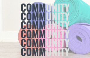 yoga mats in background with text saying community the seed by Theraplayoga