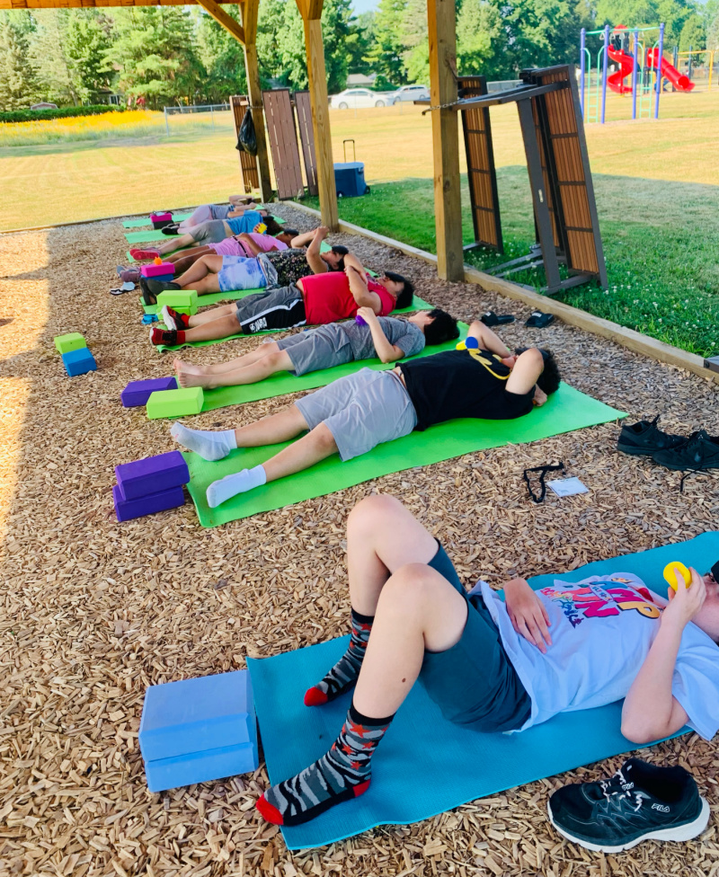 Inclusive Yoga for Community Outreach: children laying on yoga mats
