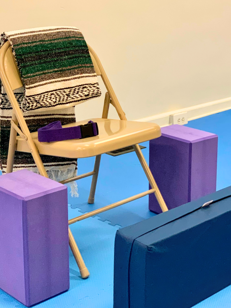 Adaptive Yoga Props at TheraPLAYoga: chair, large blocks, blanket, straps, bolster